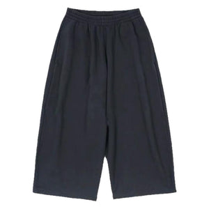 Loose-fitting sweatpants side profile showing relaxed tapered leg