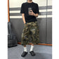 Front view of the camo ripped cargo shorts, variant image for size XXL, long loose cut with cargo pockets