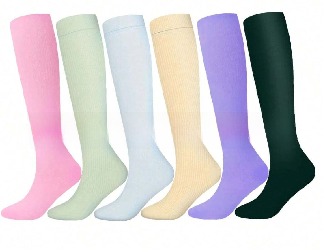 Knee high graduated compression sport socks displayed as a colour assortment