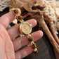 Womens quartz bracelet watch with round stone beads set in gold tone links