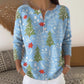 Side view of the festive Henley knit top showing long ribbed cuff sleeve