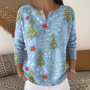 Side view of the festive Henley knit top showing long ribbed cuff sleeve