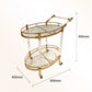 Golden stainless steel mobile serving cart with steering handle and four wheels