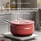 Bordeaux red 30 cm non-stick wok with matching lid and steamer tier on an induction cooktop in a kitchen