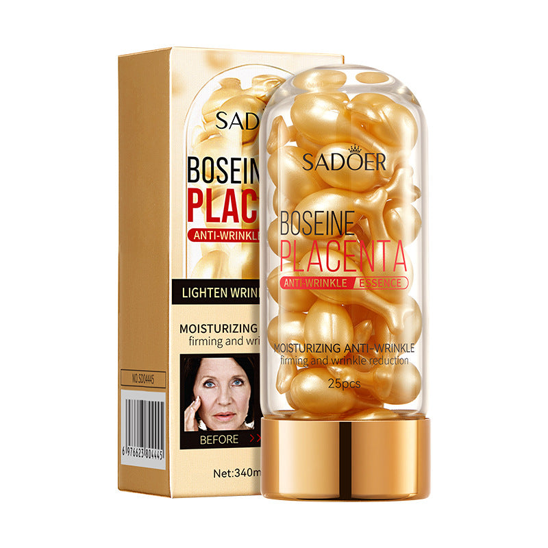 Gold placenta essence capsules in a bottle beside its gold box