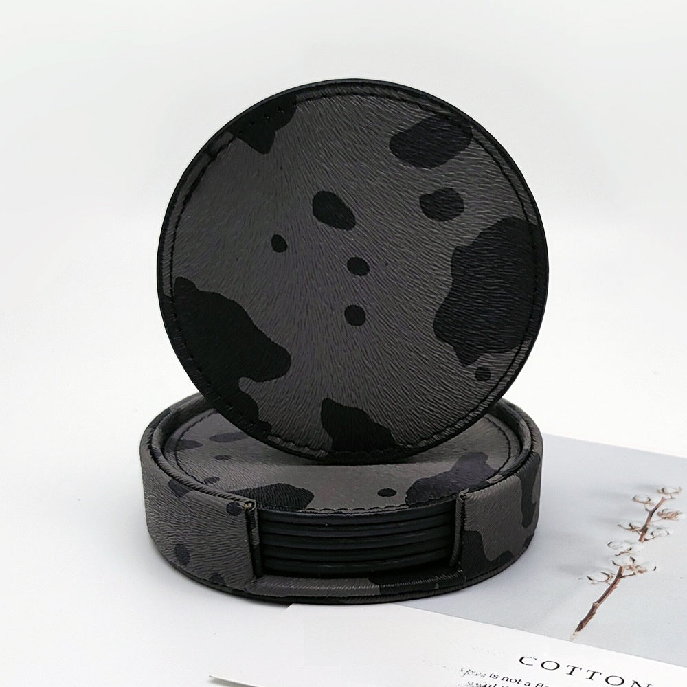 Black cow print PU leather round coaster set with a matching holder