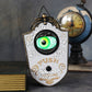 Halloween eyeball doorbell prop, cast PVC plaque with a single green eye and Push To Ring lettering