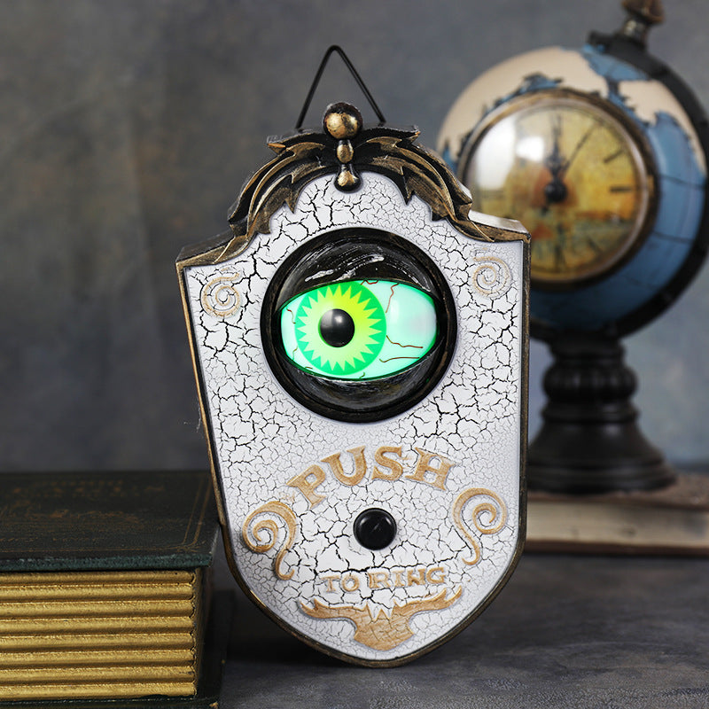 Halloween eyeball doorbell prop, cast PVC plaque with a single green eye and Push To Ring lettering