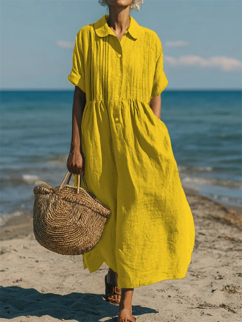 Short-sleeve cotton linen dress shown in a calm neutral setting