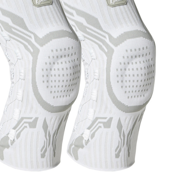 Close-up of the silicone patella pad and side support panels on the knee brace