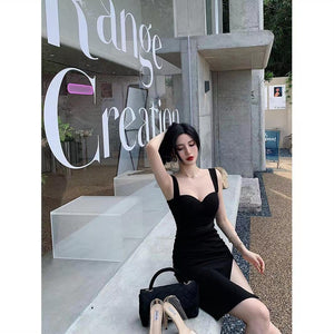 Black wide-strap bodycon dress shown from the side with the sweetheart neckline
