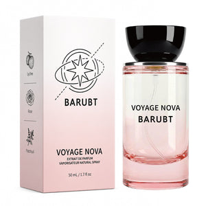Pink glass Voyage Nova extrait de parfum bottle beside its carton showing lychee rose and patchouli