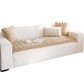 Camel quilted plush sofa cover with a scalloped edge on a white sofa, white background