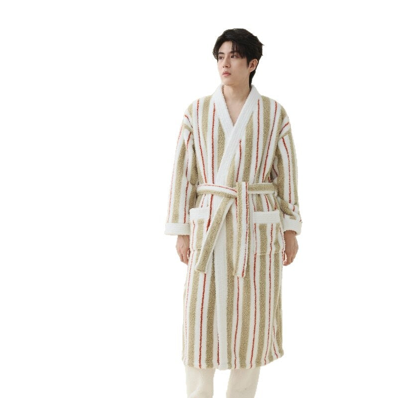 Man on a white background in an off-white striped fleece robe with olive green and red stripes and a belt