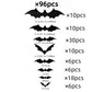 Black 3D bat wall stickers pressed onto a smooth pale wall