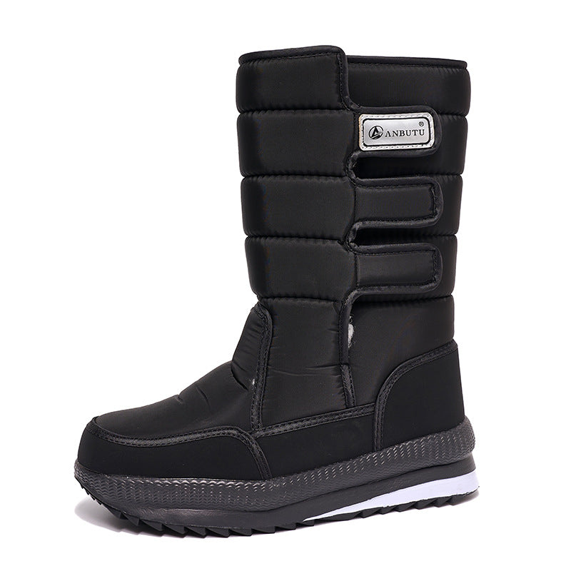 Unisex mid calf snow boot with a quilted upper and thick plush lining, studio shot
