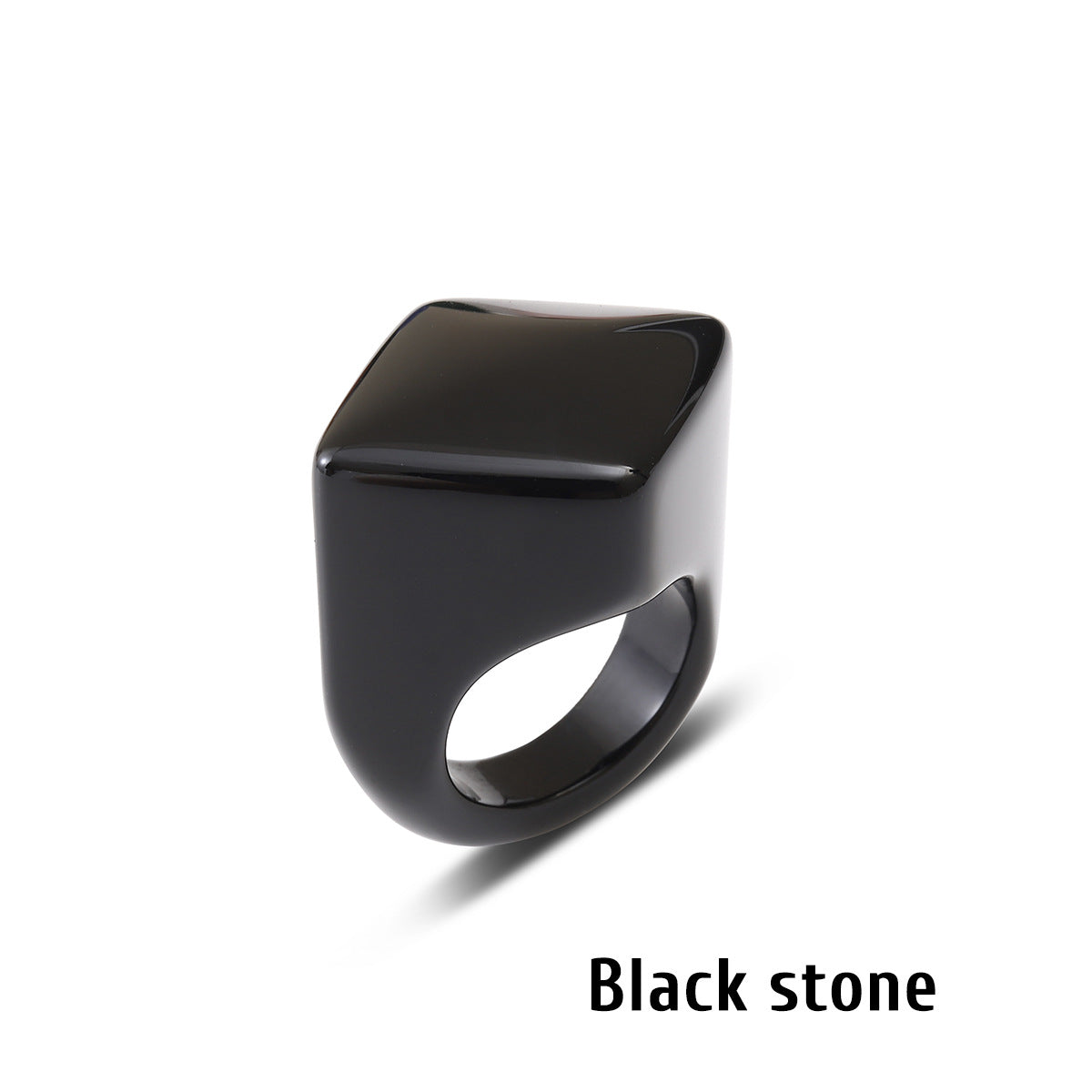 Black stone ring with a square flat face on a white background