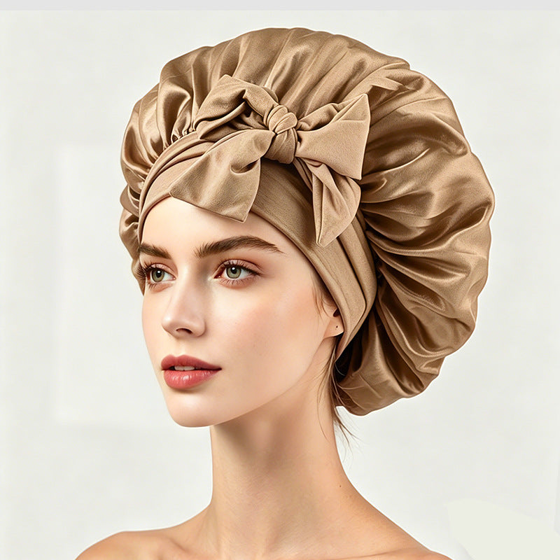 Satin hair wrap bonnet with a wide band and bow, shown as a colour option