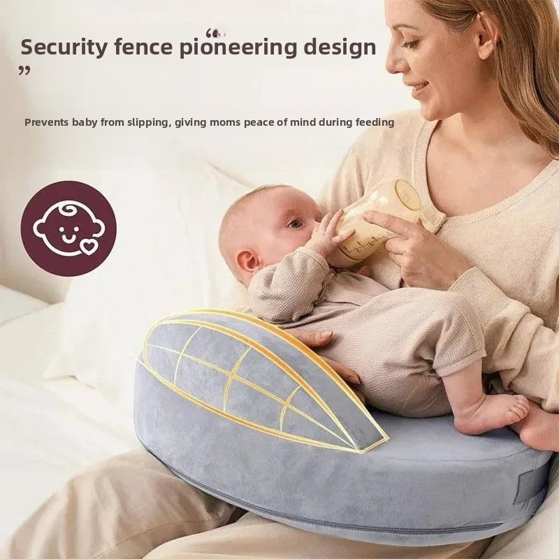 Memory foam infant nursing pillow shown beside a hand for scale reference