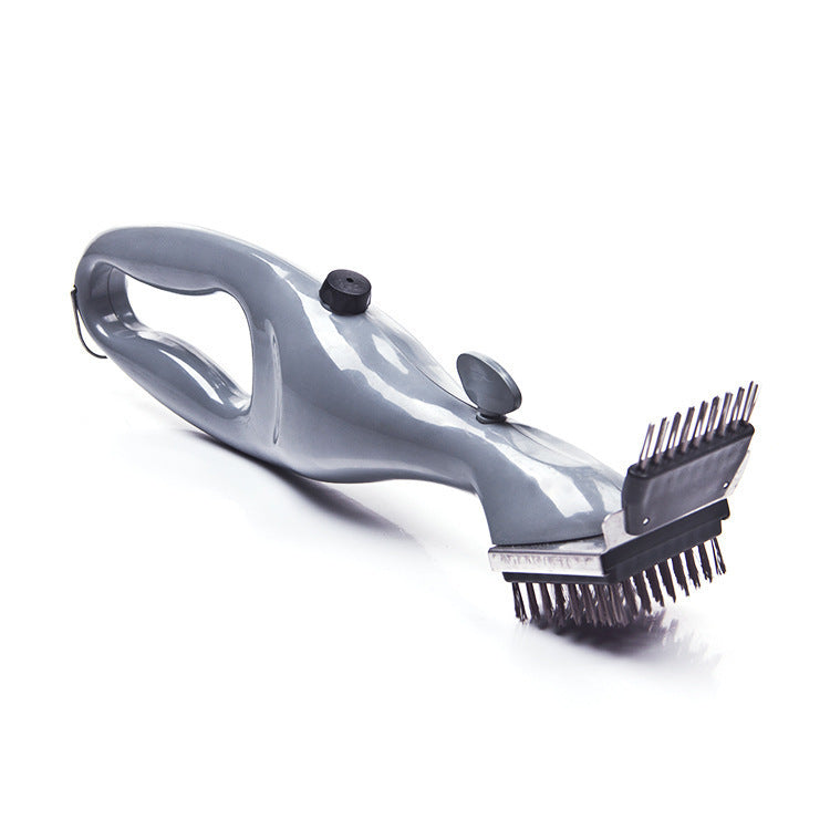 Grey plastic handled grill brush with stainless steel bristles and metal scraper head on white background