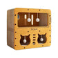 Double layer cardboard cat scratcher with pom pom balls and cat face cutout windows on the front