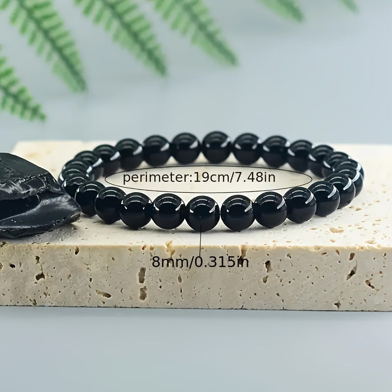 Close up of polished rose quartz and banded tiger eye beads on the bracelet