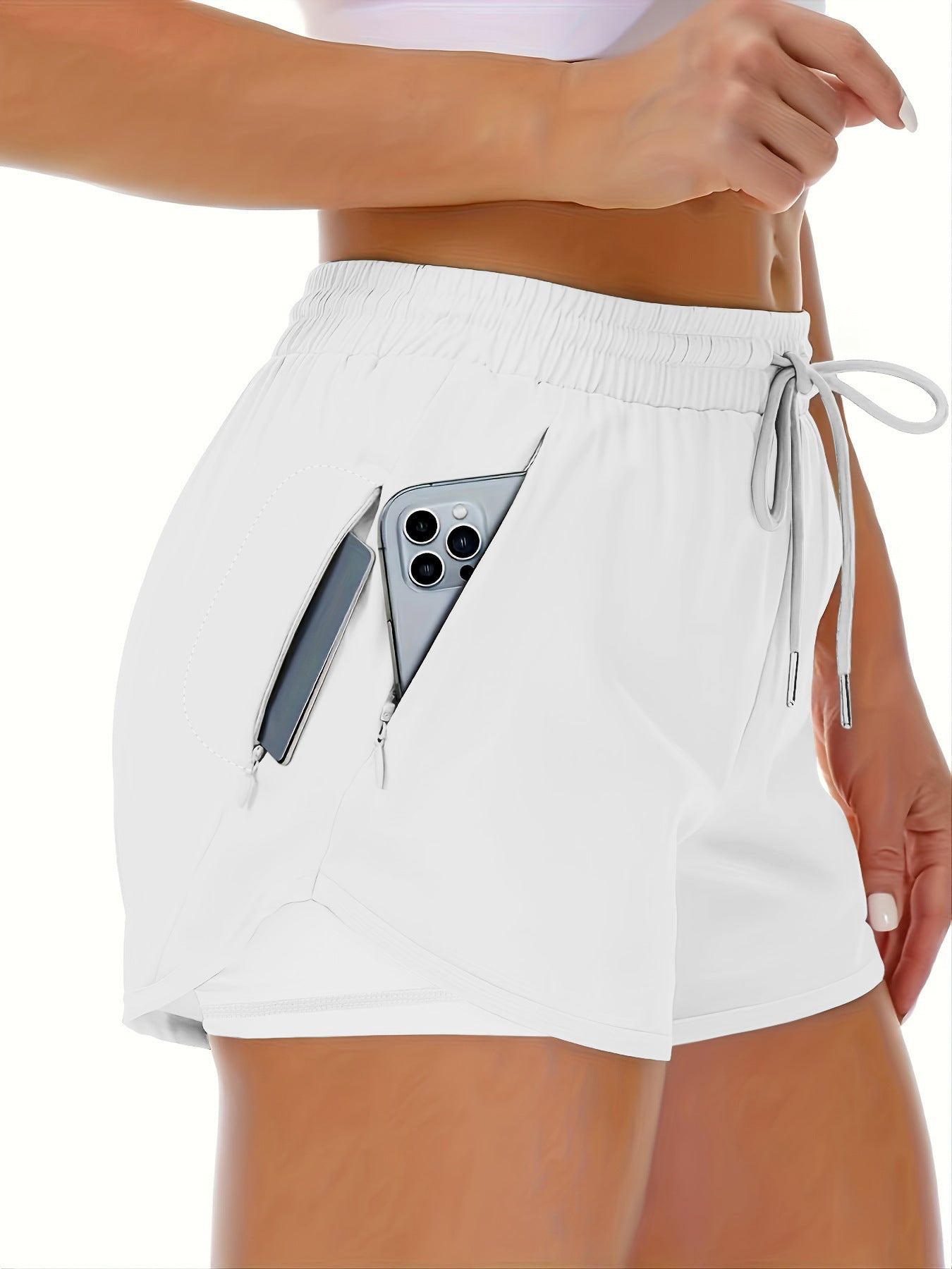 A dark gray flat lay of womens elastic fitness shorts with curved tulip hem (2)