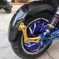 Rear fender with gold aluminum bracket fitted behind the wheel of an electric scooter on a street