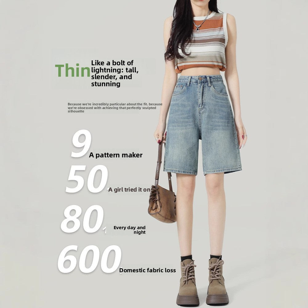 Front view of relaxed high-waisted denim shorts in light faded blue on a model