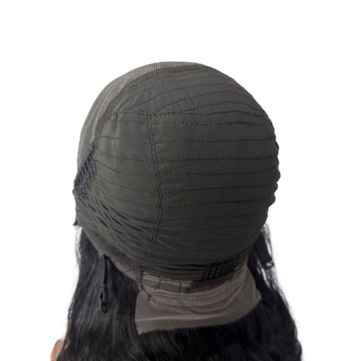 Back of the wig cap showing the stitched mesh interior and the lace edge