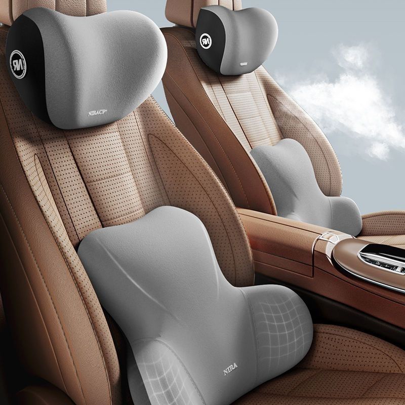 Gray car neck headrest and lumbar back cushion set fitted on a tan car seat