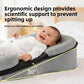 Smiling baby on a grey wedge lounger pillow with a black panel, with a yellow angle diagram and a text overlay