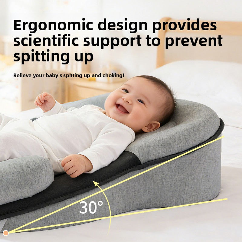Smiling baby on a grey wedge lounger pillow with a black panel, with a yellow angle diagram and a text overlay