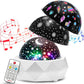 Star projector night light glowing warm in a cozy dim bedroom corner