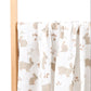 Folded cotton muslin swaddle blanket with a soft open weave and an even printed pattern