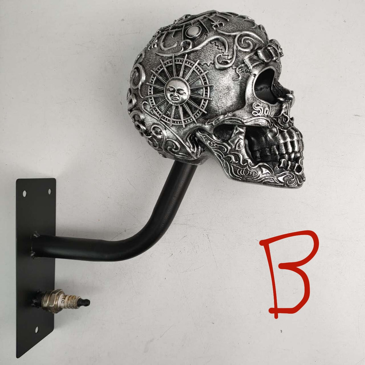 Side view of a skull helmet rack showing the metal bracket behind the resin skull