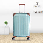 Transparent PVC luggage cover fitted over a wheeled spinner travel suitcase