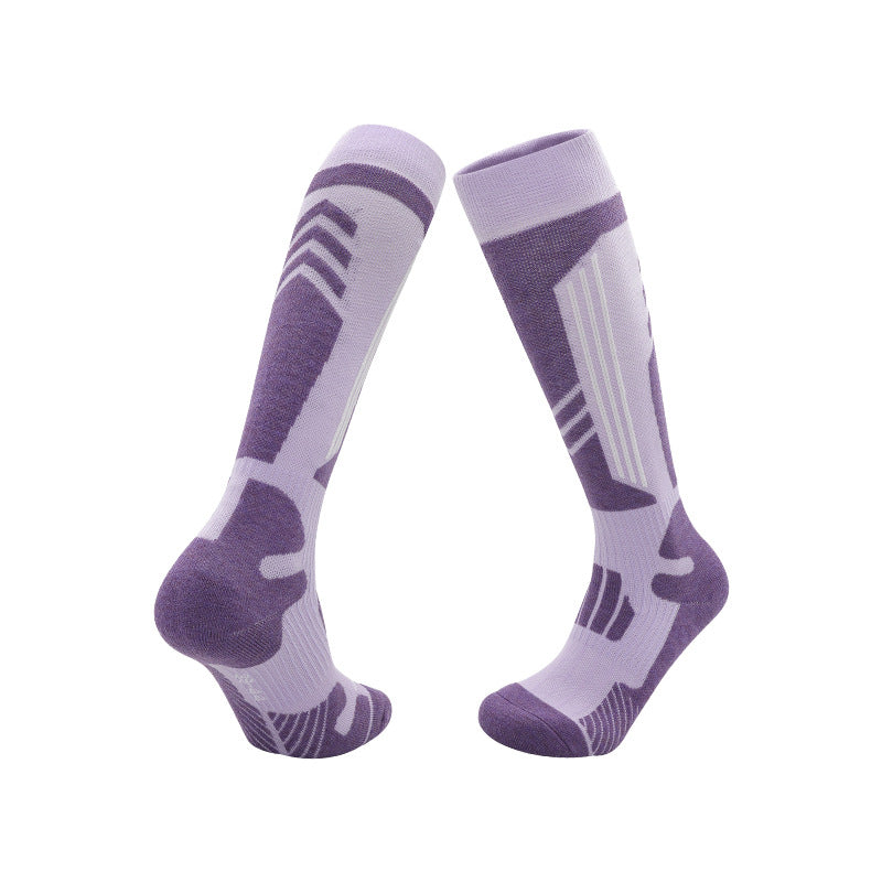 Merino wool blend ski socks with a terry towel sole and ribbed cuff, front and back view