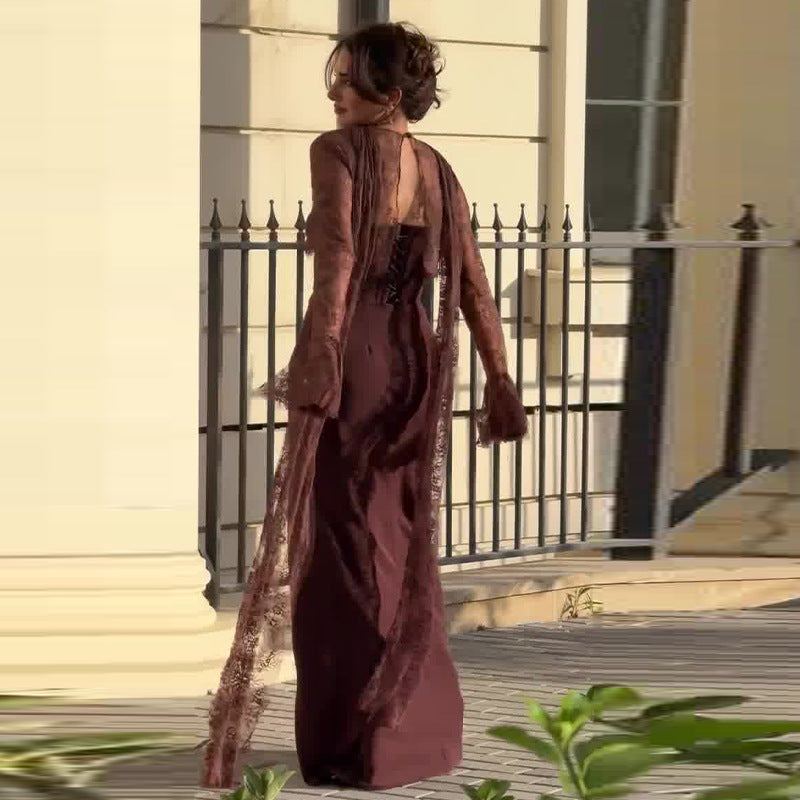 Dress hanging on a wooden hanger against a linen curtain background