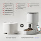 Black automatic pet feeder with clear grain bin and tray