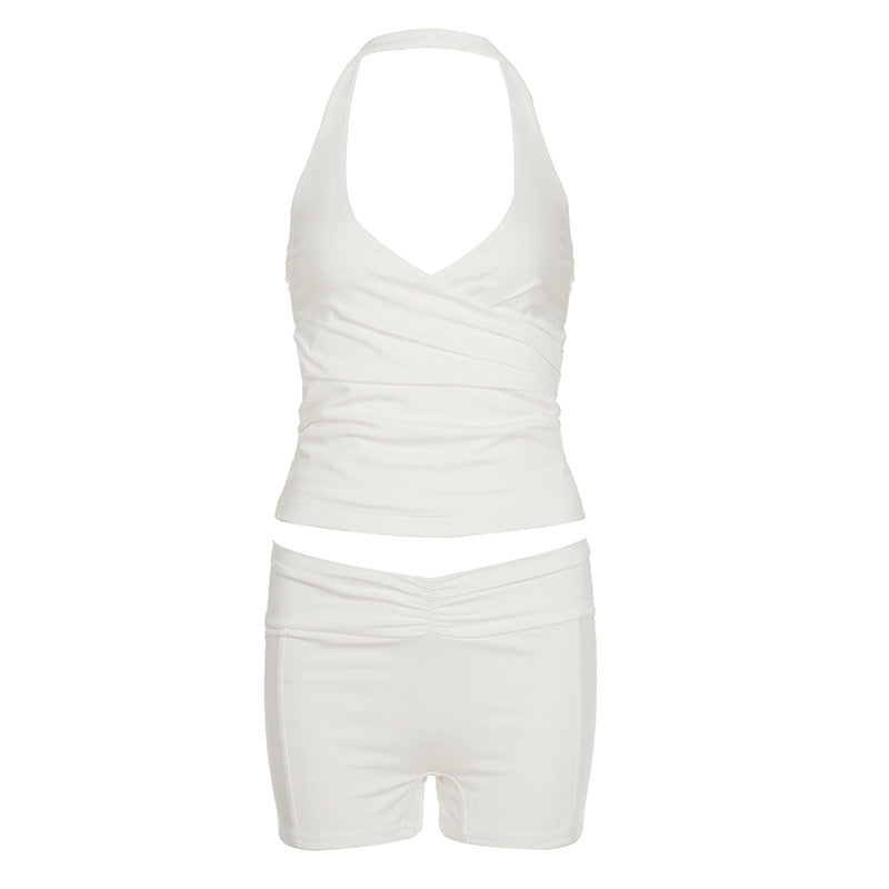 Halter neck top and high-waist shorts set in a soft stretch knit worn by a model