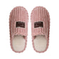 Top view of a pair of pink ribbed plush slippers with cream plush lining and brown Original labels
