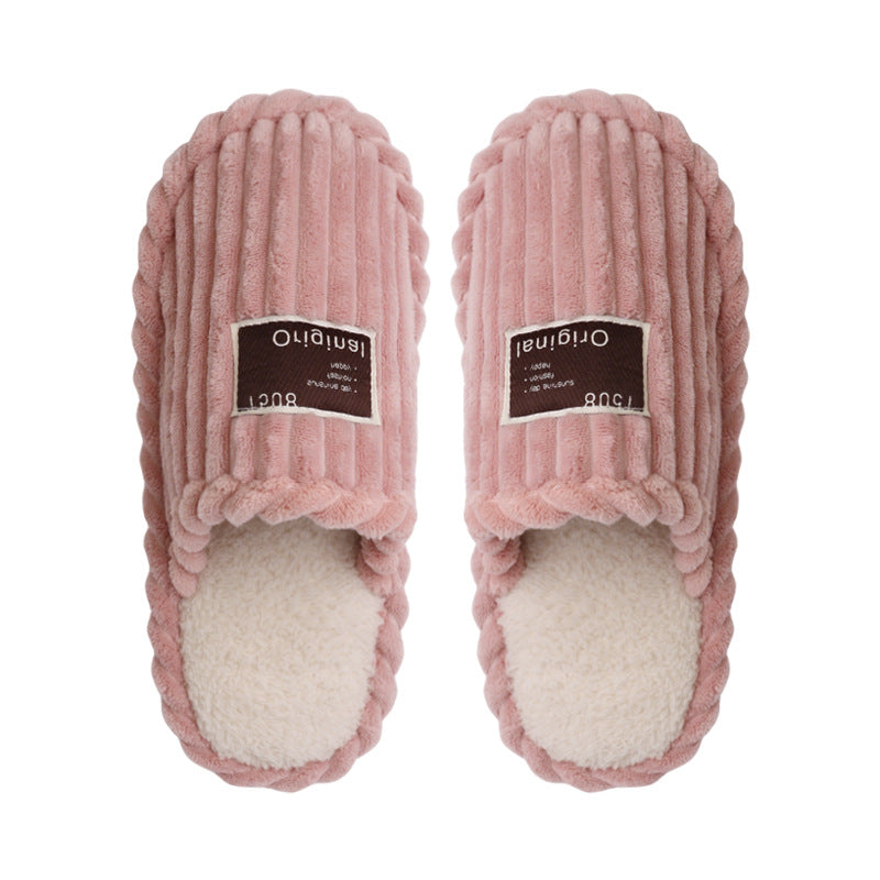 Top view of a pair of pink ribbed plush slippers with cream plush lining and brown Original labels