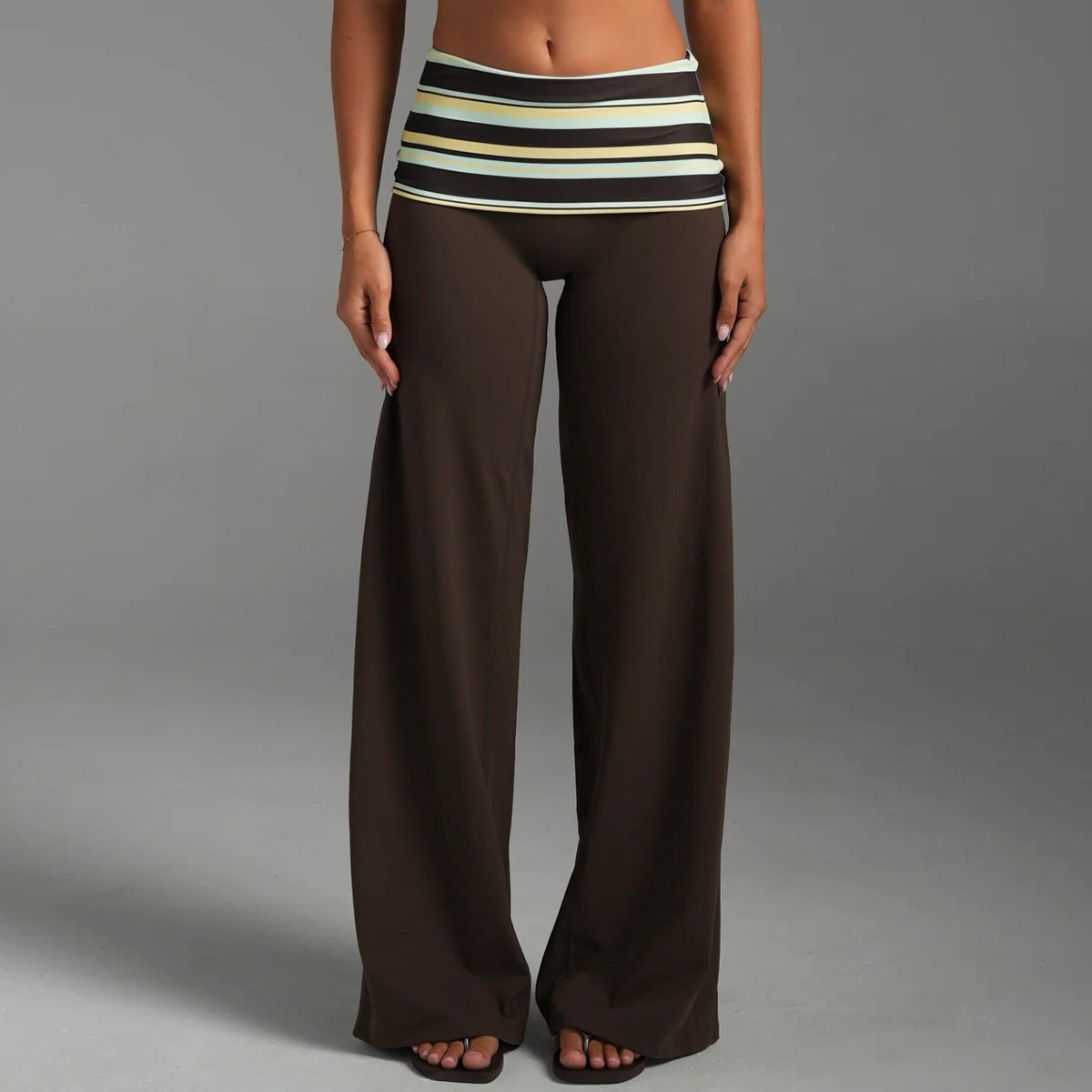 Women's fold over waist wide leg yoga pants in brown with a striped fold over waistband