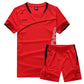 Red two piece sports kit photographed flat, no model and no styling