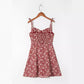 Front view of the floral strap dress with self tie shoulder straps and sweetheart bodice