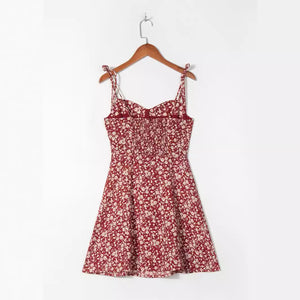 Front view of the floral strap dress with self tie shoulder straps and sweetheart bodice
