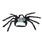 Plush black spider pet costume with eight furry legs and a skull rider on a cloth harness