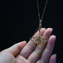 Armillary Sphere Pendant Necklace with Pivoting Gold Tone Rings