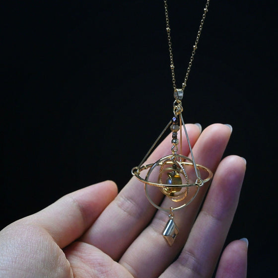 Armillary Sphere Pendant Necklace with Pivoting Gold Tone Rings